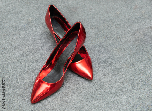 Close-up of a pair of patent red high heel shoes photo