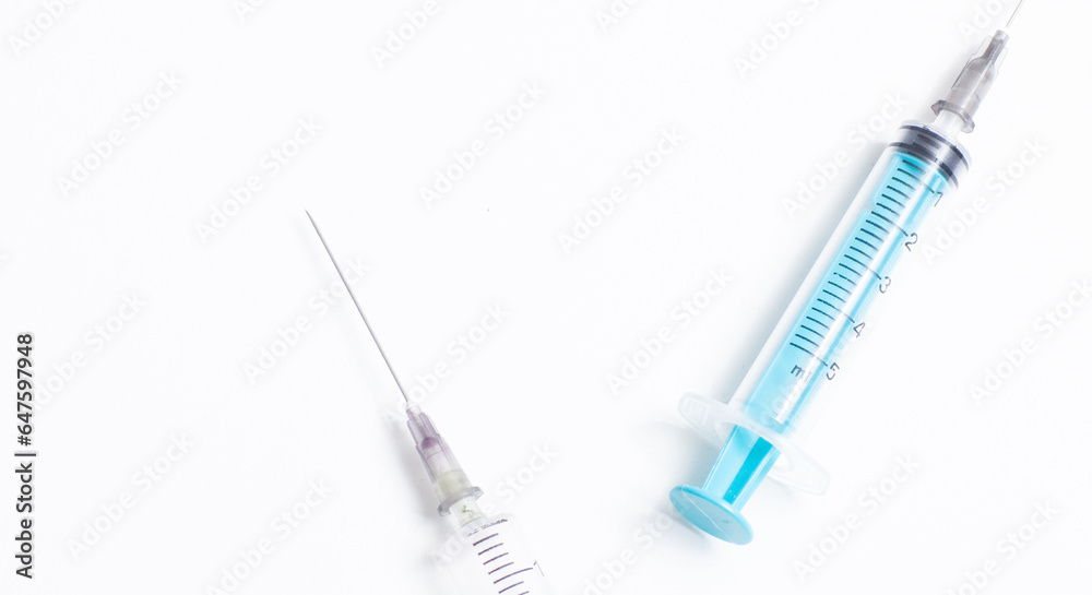 Disposable plastic syringe prepared for injection and vaccination in the hospital. The concept of medicine and health Disposable plastic syringe prepared for injection and vaccination in the hospital. The concept of medicine and health