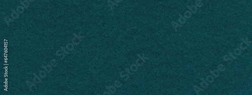 Texture of craft dark green and emerald paper background colors, macro. Structure of vintage kraft teal cardboard.