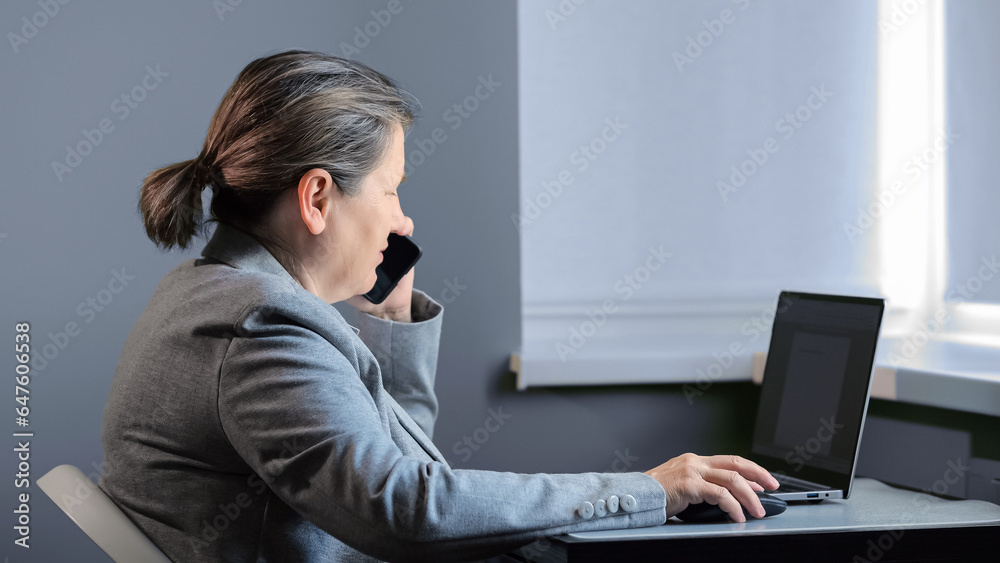 Woman worker talks with client about preferences in business project. Office employee enters information based on customer desires in computer, close6up Woman worker talks with client about preferences in business project. Office employee enters information based on customer desires in computer, close6up