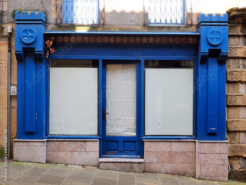 facade of an old abandoned shop in the historic center of the old town of Hondarribia in the heart of the beautiful and green Basque country, in the North of Spain, near the Atlantic coast