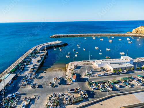 Obraz na płótnie Aerial view landscape, view of port in Portugal Albufeira, fishing boats, waterfront marina. w salonie