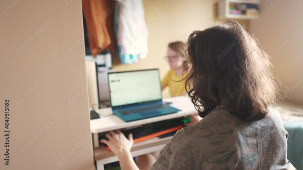 students sit and work at computers. modern business concept of training and development. two students are doing a project in a team for university. online learning at lifestyle computer and laptop students sit and work at computers. modern business concept of training and development. two students are doing a project in a team for university. online learning at lifestyle computer and laptop