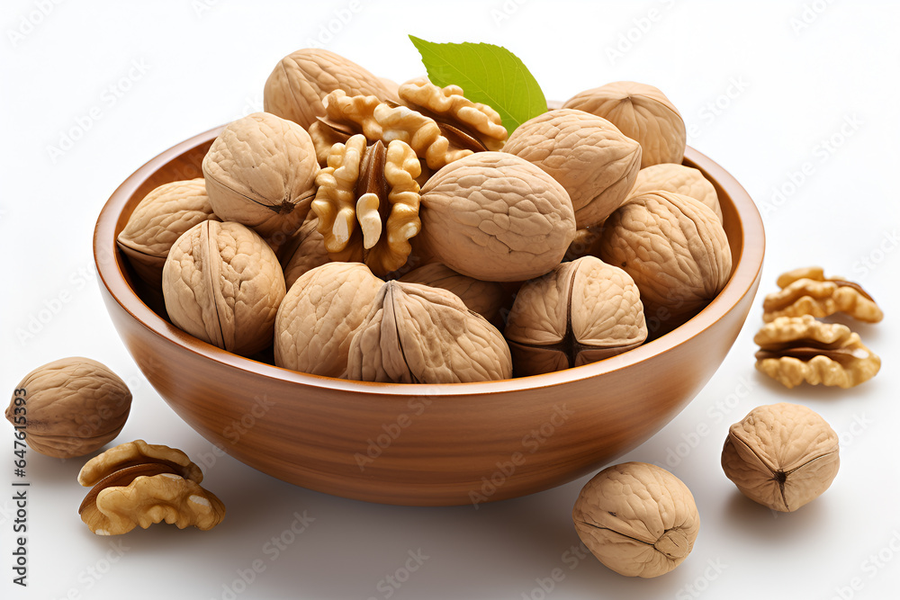 walnuts in a wooden bowl isolated on white background walnuts in a wooden bowl isolated on white background