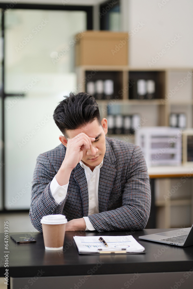 Failed work concept, sad businessman is sitting at table. Stress. Failed work concept, sad businessman is sitting at table. Stress.