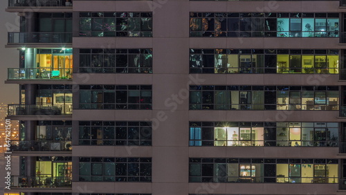 Windows lights in modern office and residential buildings timelapse at night