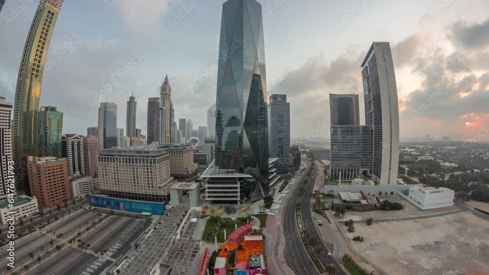 Obraz premium Panorama of Dubai International Financial district aerial night to day timelapse. View of business office towers.