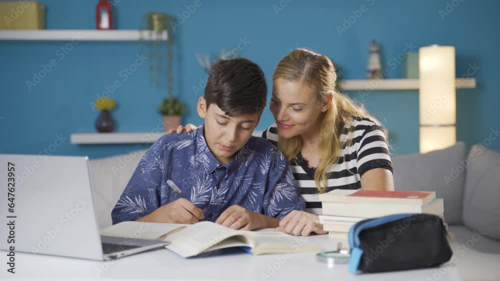 Mother helping her son with his lessons. Morale and support of mother to her son. Mother helping her son with his lessons. Morale and support of mother to her son.