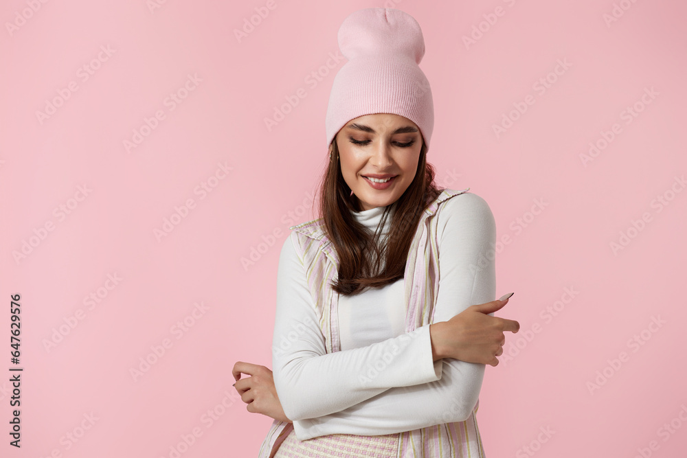 Happy playful young woman in pink hat, shirt and skirt Happy playful young woman in pink hat, shirt and skirt