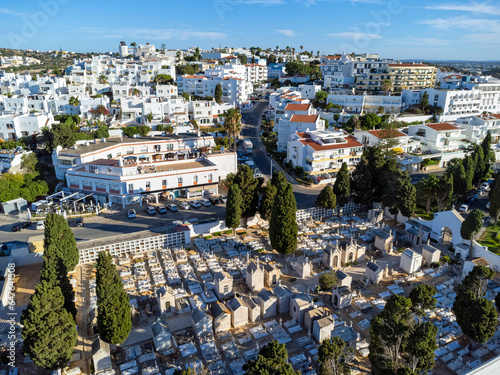 Obraz na płótnie Aerial view landscape, drone view of town, white houses, cemetery and green surroundings. Portugal Algarve. w salonie