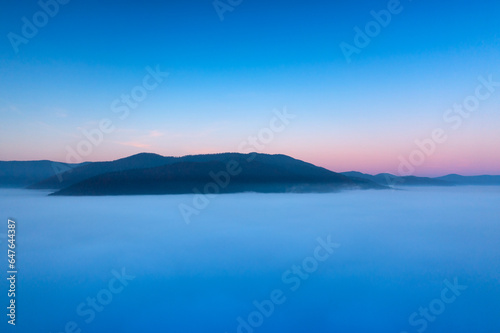 Misty Mountain Sunrise  A Silhouetted Landscape