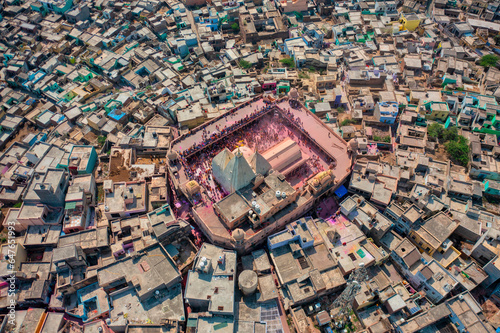 Aerial view of people celebrating the holy colour festival near the Shri And Baba Temple, Uttar Pradesh, India.