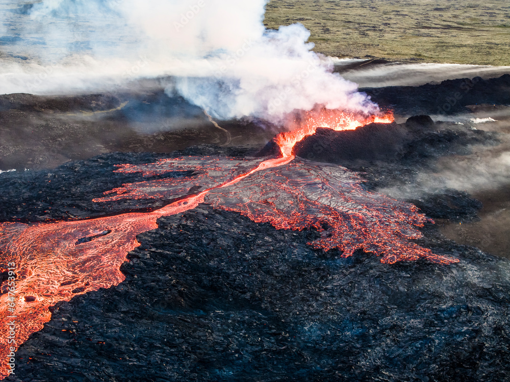 Aerial view of Litli-Hrutur (Little Ram) Volcano during an eruption on Fagradalsfjall volcanic area in southwest Iceland, it's a fissure eruption started on the Reykjanes Peninsula, Iceland. Aerial view of Litli-Hrutur (Little Ram) Volcano during an eruption on Fagradalsfjall volcanic area in southwest Iceland, it's a fissure eruption started on the Reykjanes Peninsula, Iceland.
