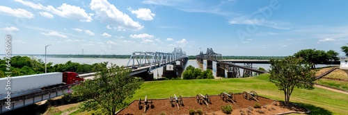 Panorama row of canons display at historic Vicksburg battlefield overlooking twin old new bridges across Mississippi River, artillery during siege of civil war, Mississippi, USA photo