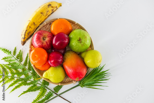 Healthy organic food background. Studio photo of different fruits on white background. High resolution image. Food photography of different fruits isolated white background with copy space.