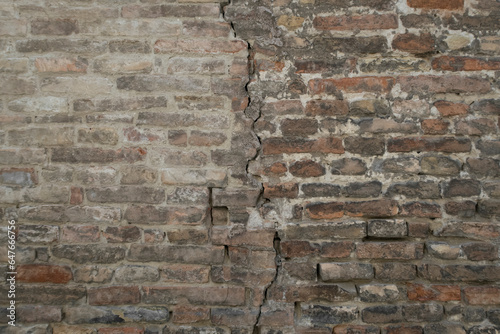 Crack on brick wall. Grunge background