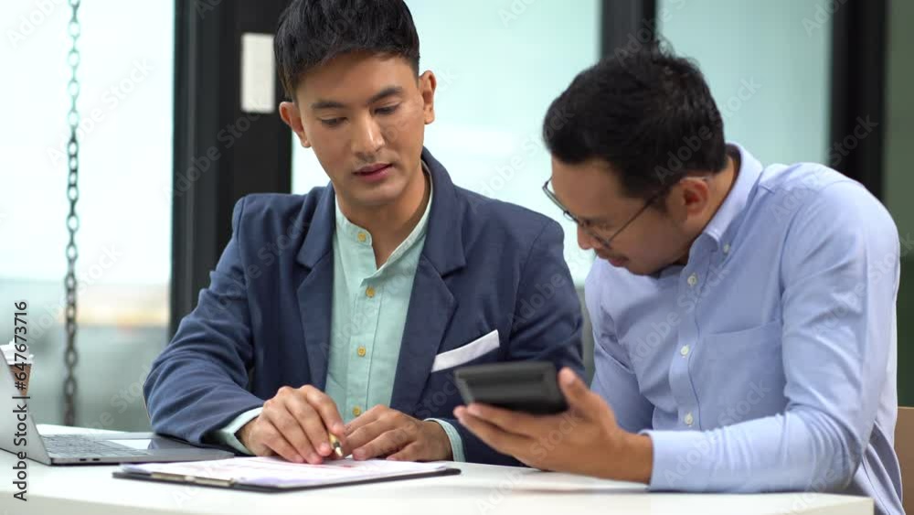 Businessmen team or financial data analysts working with tablets and laptop computers and data graphs together. Plan to analyzing projects in the office. Businessmen team or financial data analysts working with tablets and laptop computers and data graphs together. Plan to analyzing projects in the office.