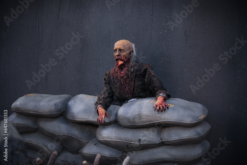 Zombie figure in trench for Halloween decoration photo