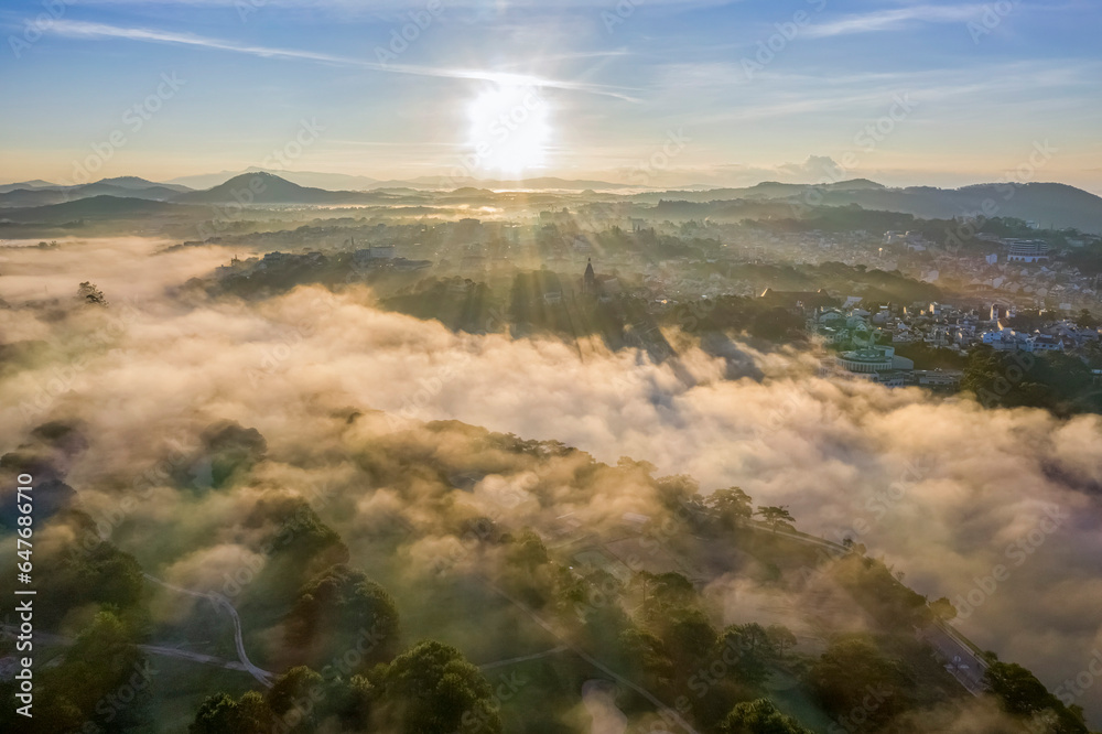 Top view aerial photo from flying drone of a Da Lat City with development buildings and fog,nature beautifull, famoust travel city of Vietnam. Doi Cu area