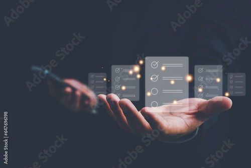 Business performance checklist, Quick checklist and clipboard management concept, job applicants, businessman using laptop doing online checklist survey,Employees must complete the online survey form.
