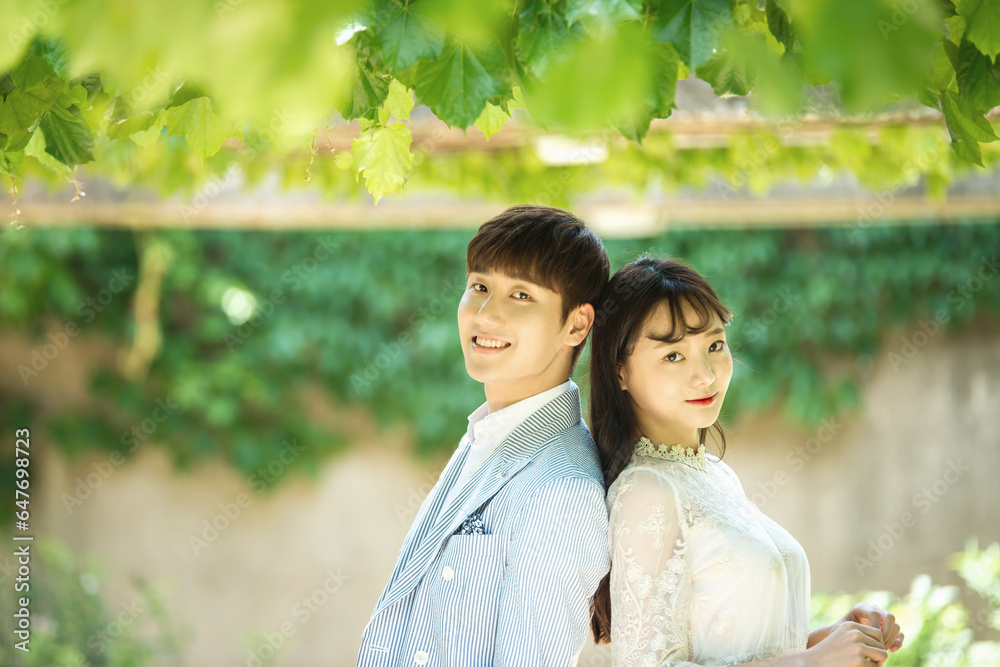 A loving couple is taking wedding photos outdoors for their wedding. A loving couple is taking wedding photos outdoors for their wedding.
