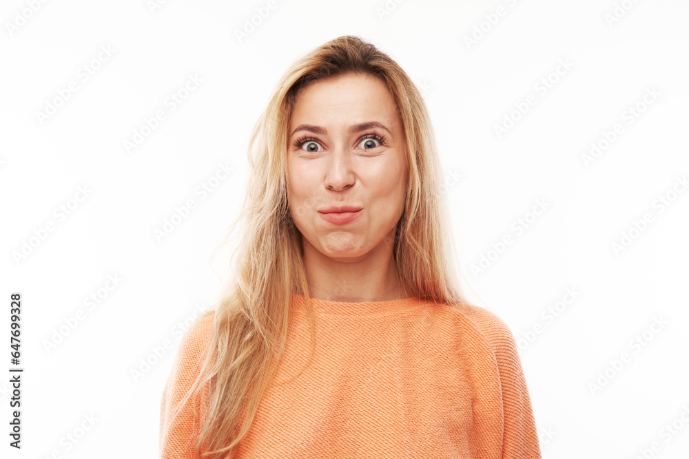 Portrait of young blond woman puffing cheeks with funny face isolated on white studio background. Humor concept, mouth inflated with air crazy expression. - obrazy, fototapety, plakaty 