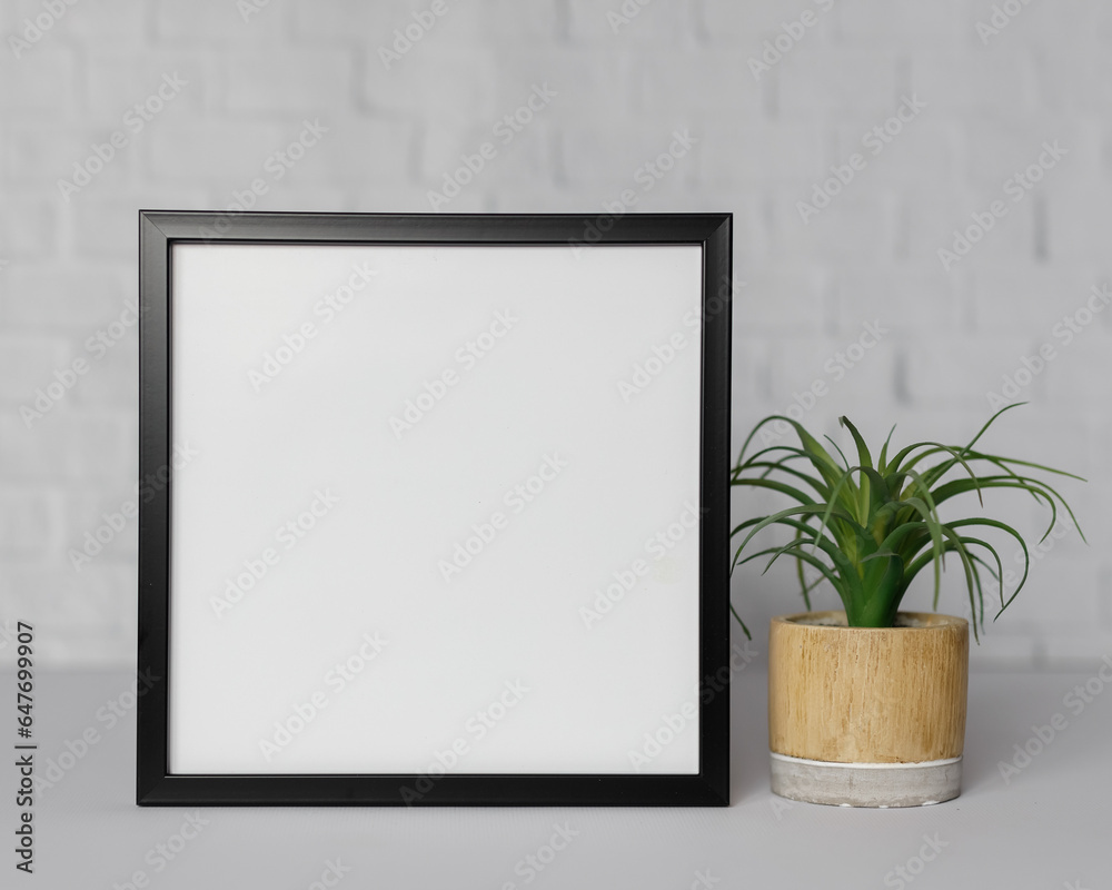 Minimal wooden picture poster frame mockup on white wallpaper Minimal wooden picture poster frame mockup on white wallpaper