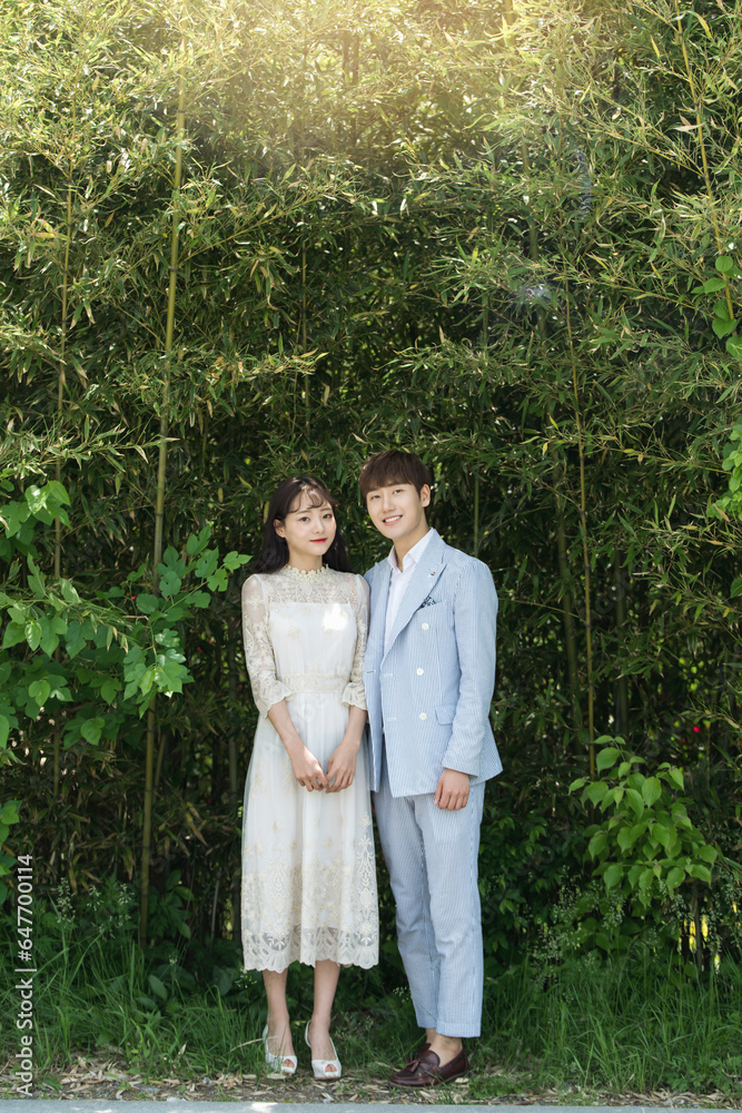 A loving couple is taking wedding photos outdoors for their wedding. A loving couple is taking wedding photos outdoors for their wedding.