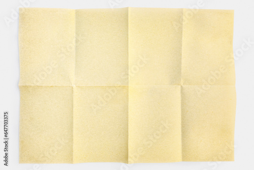 Parchment paper folded in eight, isolated on white