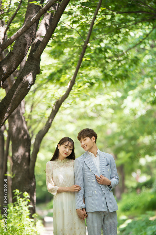 A loving couple is taking wedding photos outdoors for their wedding. A loving couple is taking wedding photos outdoors for their wedding.