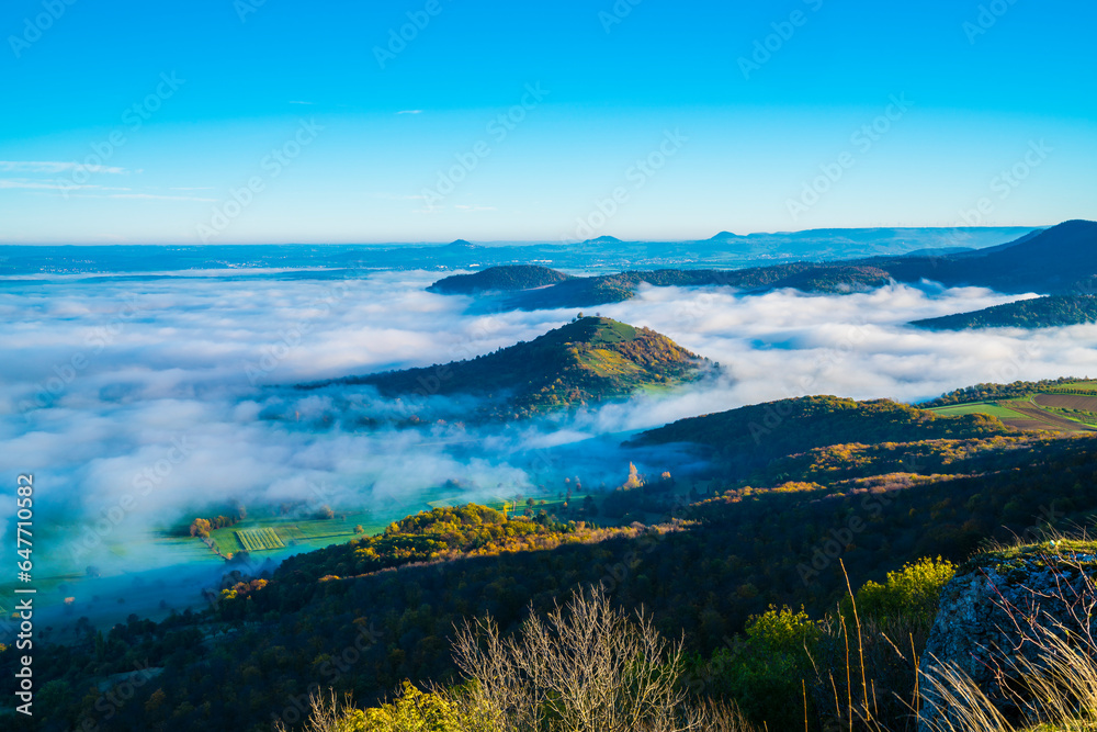 Germany, Beautiful aerial panorama view above foggy nature landscape trees valley mountains early morning sunrise autumn view at limburg bissingen an der teck