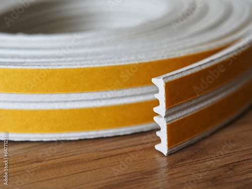 Door and window rubber seal strip. Self adhesive rubber gasket. Sealing tape for windows and doors in a roll. Rubber sealant for windows and doors
