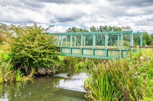 A view towards a bridge over the Erewash canal beside the Bennerley Viaduct in summertime
 photo