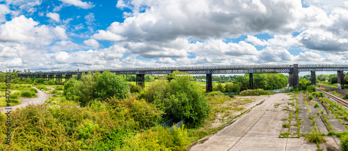 A panorama view across the Bennerley Viaduct over the Erewash canal in summertime