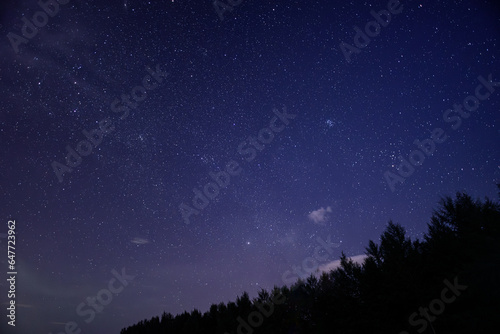 Purple night sky full of stars as background