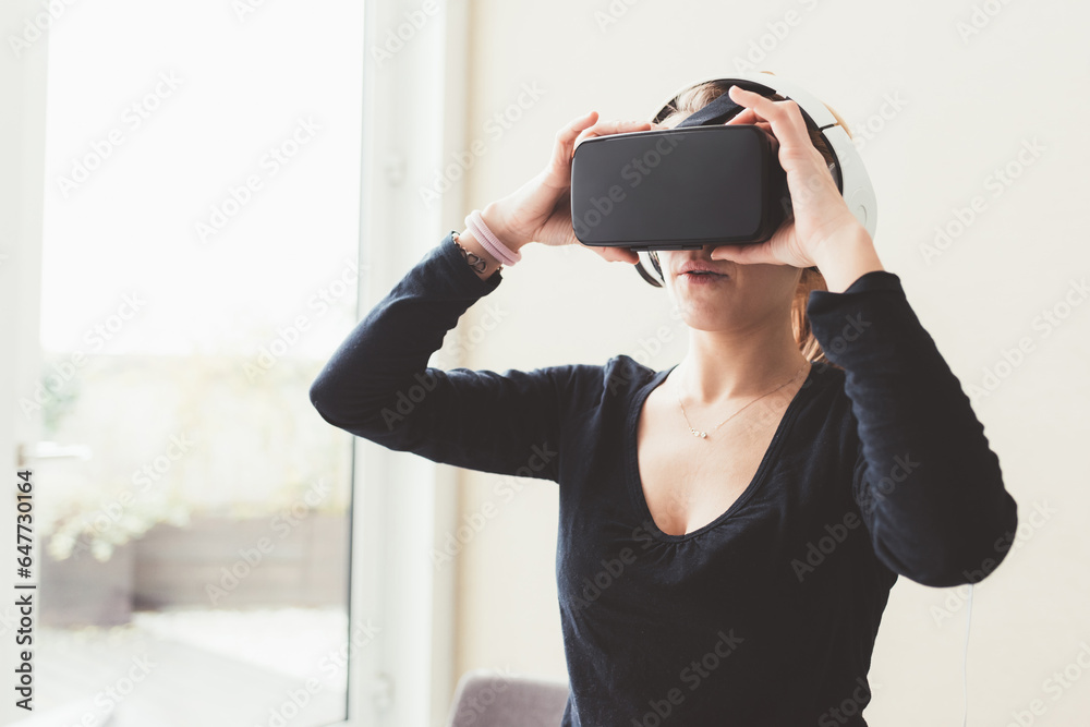 young adult woman playing videogame with 3D viewer young adult woman playing videogame with 3D viewer