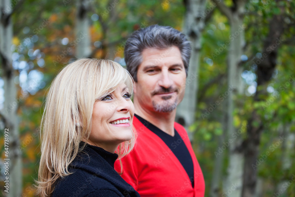 Husband And Wife Together In A Park In Autumn; St. Albert, Alberta, Canada Husband And Wife Together In A Park In Autumn; St. Albert, Alberta, Canada