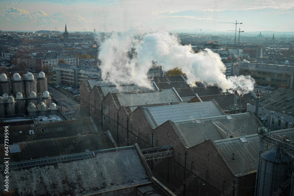 Naklejka premium panorama of the city industrial part of dublin Ireland with fog and moody weather smoke
