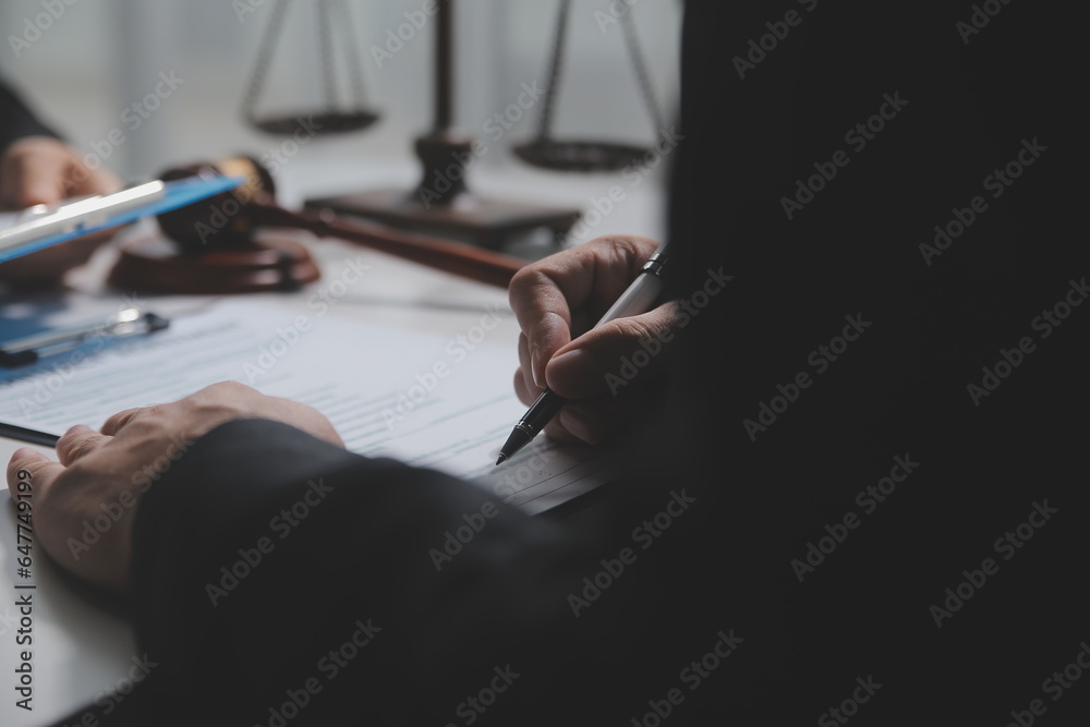 Fototapeta premium female lawyers working at the law firms. Judge gavel with scales of justice. Legal law, lawyer, advice and justice concept.