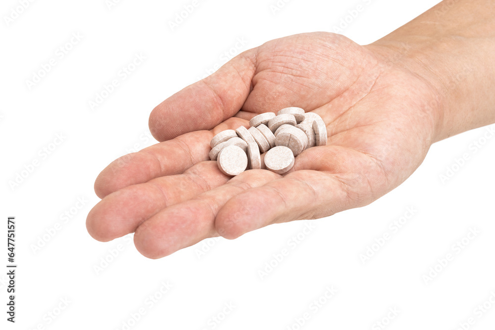 Round therapeutic pills or drugs for treatment in male hand palm isolated on transparent background, medicine and healthcare concept, close-up view Round therapeutic pills or drugs for treatment in male hand palm isolated on transparent background, medicine and healthcare concept, close-up view