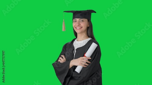 Portrait of Happy Indian college girl standing crossed hands Green screen