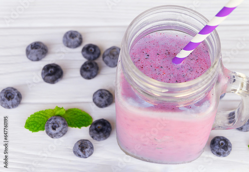 Blueberry Juice smoothies drink in a glass drink purple colorful fruit juice milkshake blend beverage healthy high protein the taste yummy in glass on white wood background.