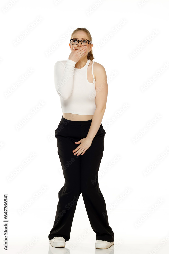 young blond woman need a toilet on white background