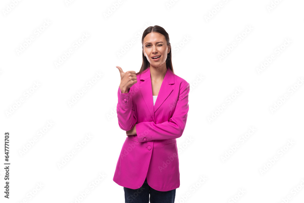 young office worker woman with black hair dressed in a pink jacket looks happy