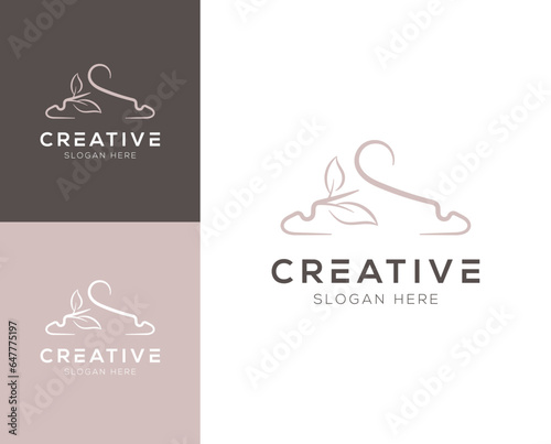 Combination of hanger and abstract leaves logo design vector illustration