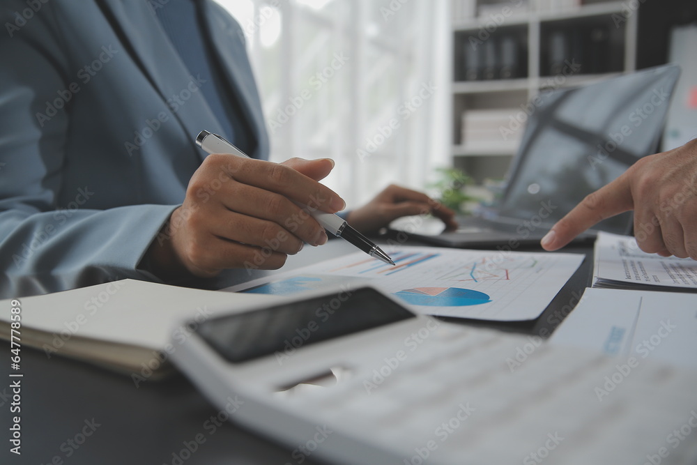 Naklejka premium Financial Business team present. Business man hands hold documents with financial statistic stock photo, discussion, and analysis report data the charts and graphs. Finance Financial concept