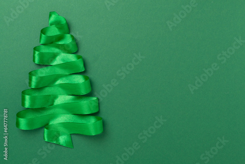 Creative handmade christmas tree on color background, top, view