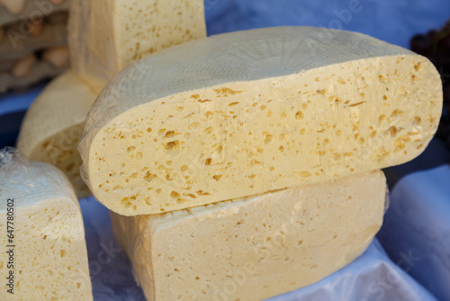 Vászonkép Dagestan homemade salty white cheese fresh in round shapes.