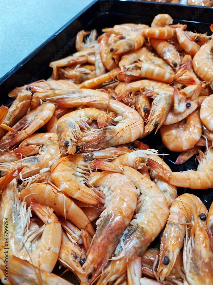 Chilled boiled shrimp in a supermarket or grocery store, close-up. Seafood Chilled boiled shrimp in a supermarket or grocery store, close-up. Seafood