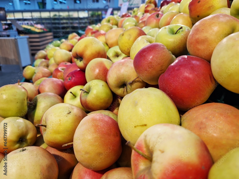 Apples in plastic boxes in a store, close-up. Ripe apples on sale, side view. Sale of fruits Apples in plastic boxes in a store, close-up. Ripe apples on sale, side view. Sale of fruits